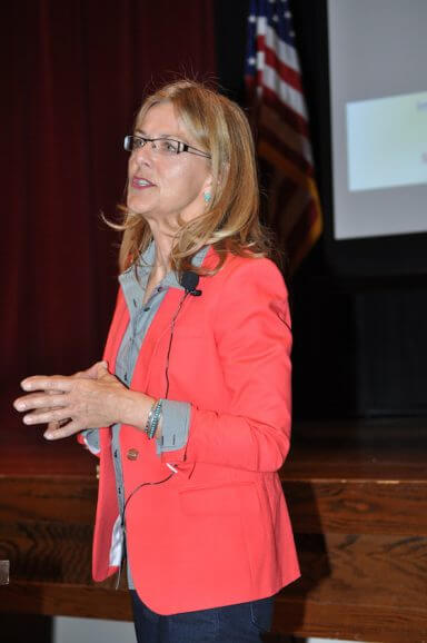 an image of lisa frederiksen speaking to symbolize an interview with lisa frederiksen