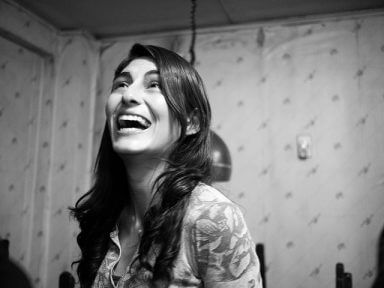 A woman looks up and smiles as she gets the most out of her AA experience