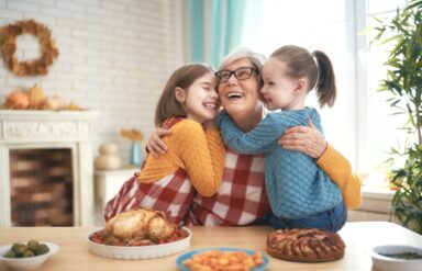 Grandmother and granddaughters celebrating Thanksgiving day