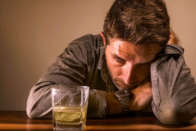 Alcoholic man looking distressed