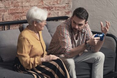 Mother talking to her adult son about her behavior